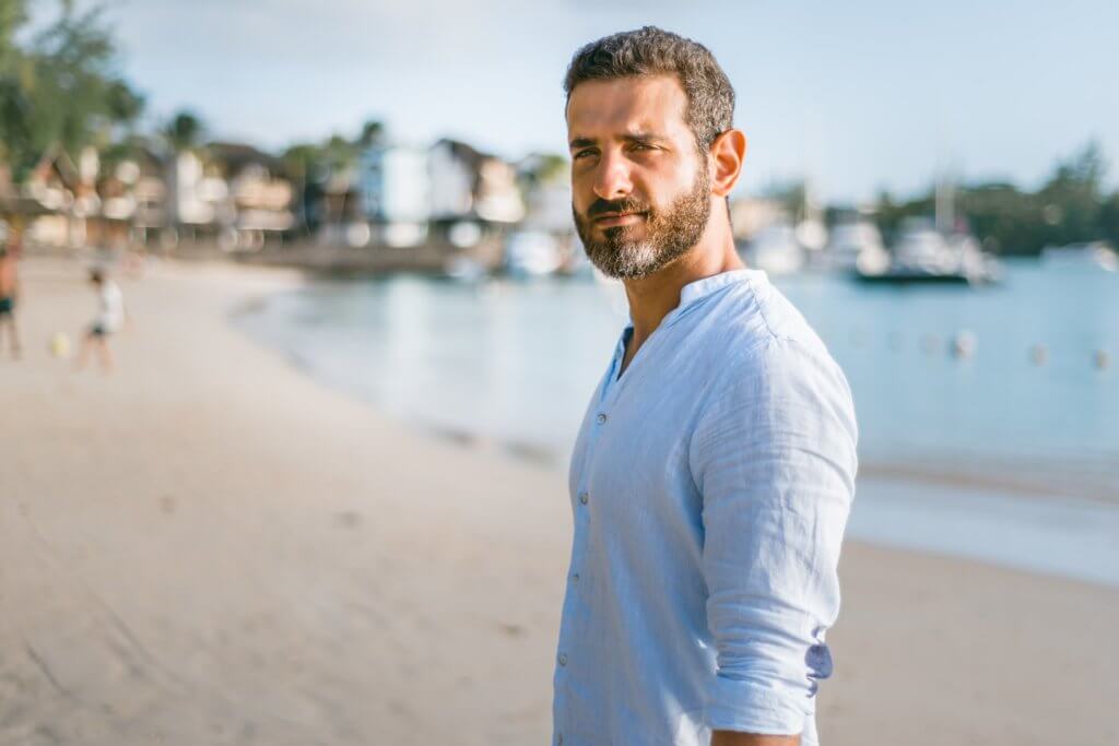 Older man with beard on beach