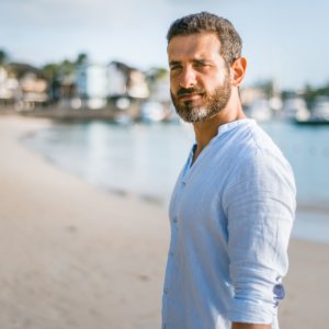 Older man with beard on beach