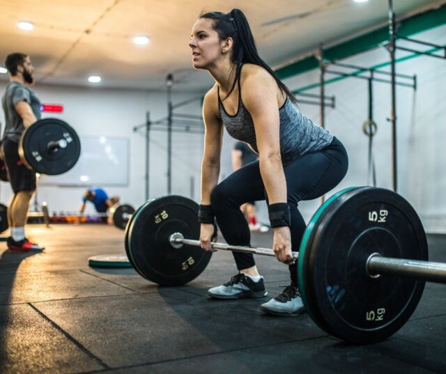 Botox near me Redondo Beach, CA Woman exercising with barbell